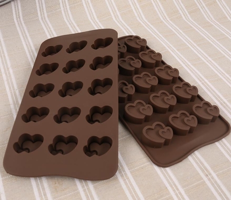 Le chocolat en forme de coeur de silicone de biscuit moule le coffre-fort remplissant facile de lave-vaisselle