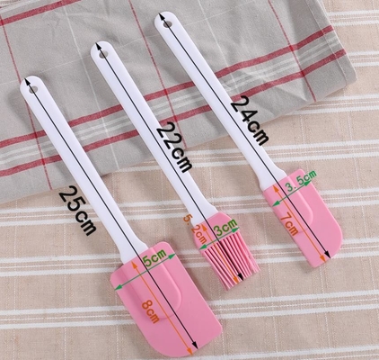 Brosse résistante à la chaleur en plastique dure de spatule, silicone faisant cuire la couleur rose de spatule