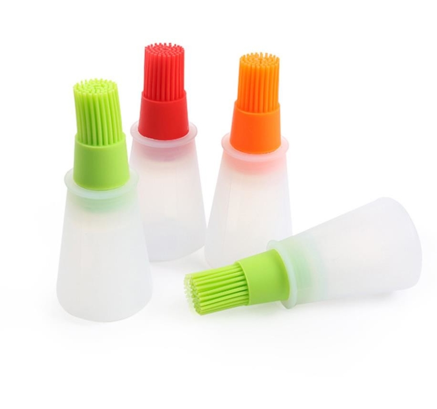 Le BBQ de catégorie comestible usine la bouteille blanche d'huile de silicone avec la brosse colorée